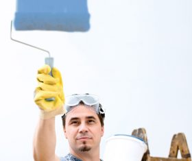 Man paint wall Stock Photo