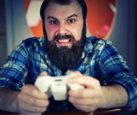Man playing game excited expression Stock Photo
