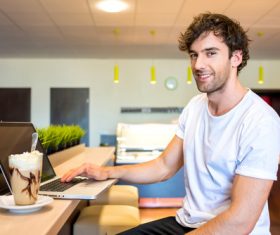 Man relaxing at home and surfing the internet Stock Photo