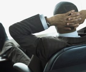 Man relaxing in the office Stock Photo