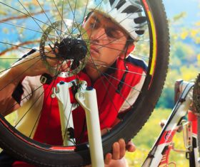 Man repairing bicycle Stock Photo