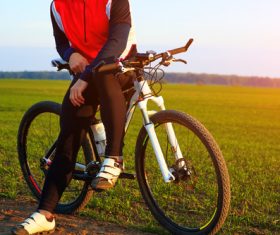 Man sitting resting on bicycle Stock Photo