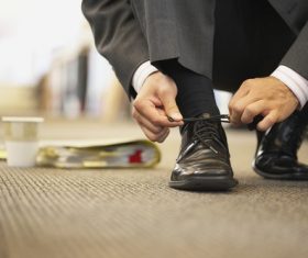 Man tying his shoelace Stock Photo