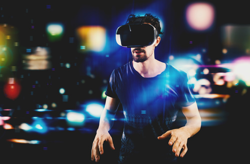 Man wearing VR virtual glasses Stock Photo