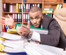 Man who cant finish work Stock Photo