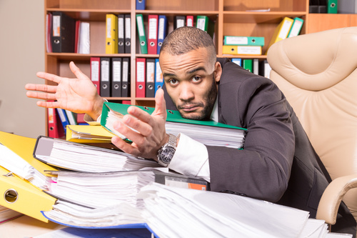 Man who cant finish work Stock Photo