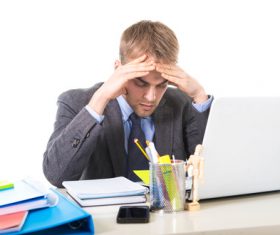 Man working exhaustedly in the office Stock Photo