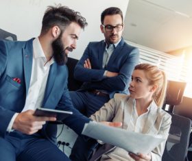 Men and women who discuss reporting issues Stock Photo