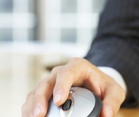 Mouse and hand close up Stock Photo