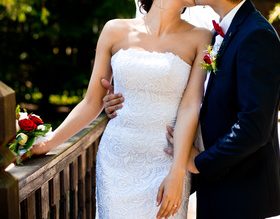 Newlyweds standing on bridge and taking wedding photographs Stock Photo 02