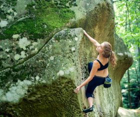 Outdoor woman unarmed rock climbing Stock Photo 03