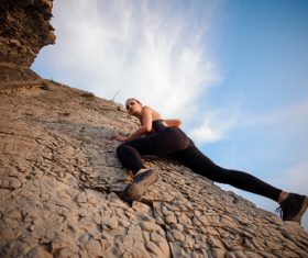 Outdoor woman unarmed rock climbing Stock Photo 04