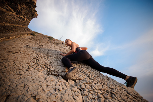 Outdoor woman unarmed rock climbing Stock Photo 04