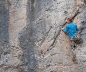 Outdoor woman unarmed rock climbing Stock Photo 05