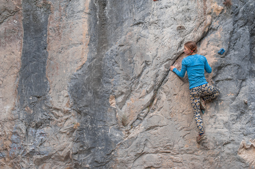 Outdoor woman unarmed rock climbing Stock Photo 05