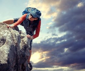 Outdoor woman unarmed rock climbing Stock Photo 06
