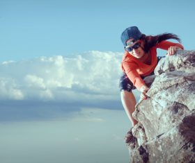 Outdoor woman unarmed rock climbing Stock Photo 07
