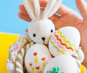 Painted Easter Eggs in Basket Stock Photo