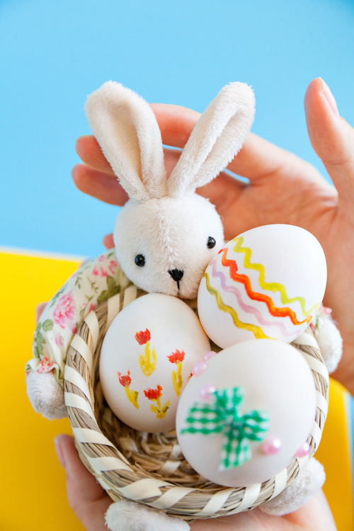 Painted Easter Eggs in Basket Stock Photo