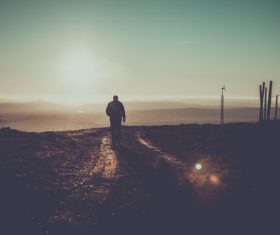 People walking on the muddy road Stock Photo