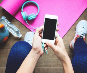 People watching mobile phones after exercise Stock Photo