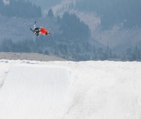 Person performing bicycle acrobat on mountain Stock Photo