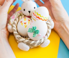 Rabbit basket and easter eggs Stock Photo