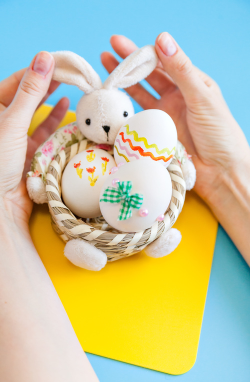 Rabbit basket and easter eggs Stock Photo