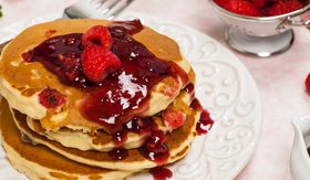 Raspberry Sauce and Flapjack Stock Photo