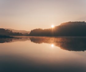 Reflection of dusk scenery on calm lake Stock Photo