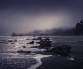 Rocky seascape at dusk Stock Photo