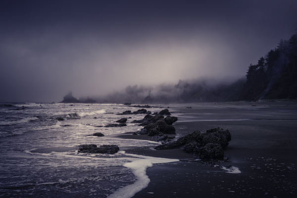 Rocky seascape at dusk Stock Photo