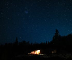 Small cottage under starry sky Stock Photo