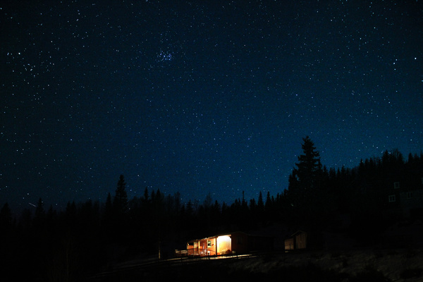 Small cottage under starry sky Stock Photo