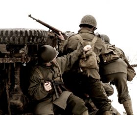 Soldier hiding behind bunker Stock Photo