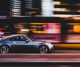 Sport car driving fast on street Stock Photo