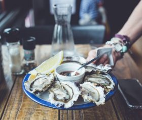 Steamed oysters and sauces and lemon Stock Photo