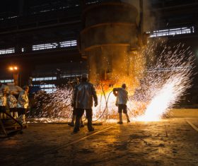 Steelmaking plant and steel workers Stock Photo