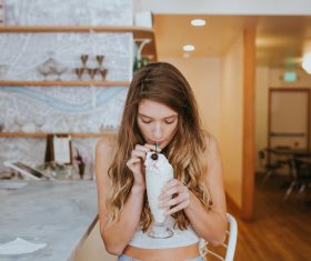 Stylish young girl relaxed with cream cocktail Stock Photo