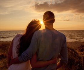 Sweet couple enjoying the sunset Stock Photo 01