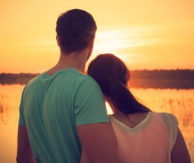 Sweet couple enjoying the sunset Stock Photo 03