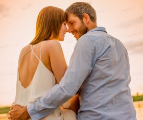 Sweet couple enjoying the sunset Stock Photo 06