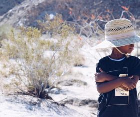 Tiny black boy with confident posing style Stock Photo