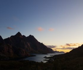 Tranquil mountain lake scenery at dusk Stock Photo
