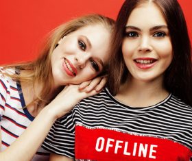 Two girls posing with red background Stock Photo 09
