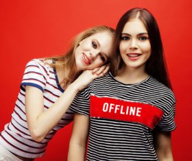 Two girls taking pictures in the studio Stock Photo 01