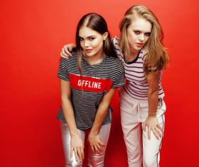 Two girls taking pictures in the studio Stock Photo 03