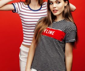 Two girls taking pictures in the studio Stock Photo 04