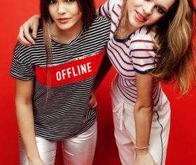 Two girls taking pictures in the studio Stock Photo 07