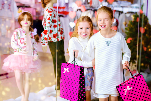Two little girls shopping in the mall Stock Photo